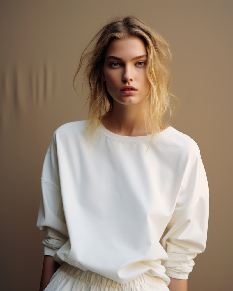 Cream cotton shirt in a taupe studio portrait